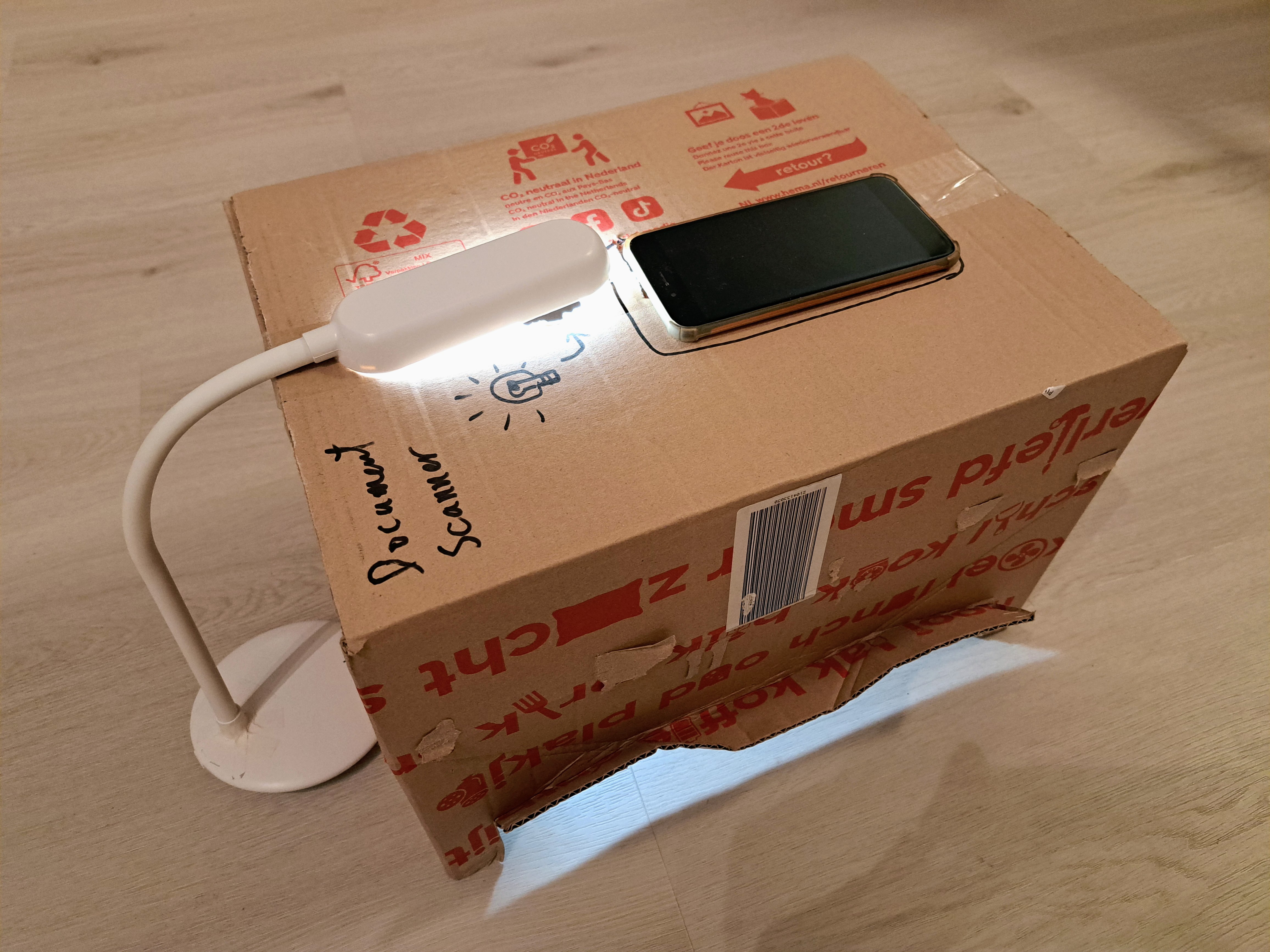 The scanner box in action, with phone and lighting